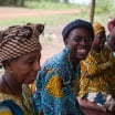 An older man smiles at Nguala club for older people (taken by Simon Rawles) 