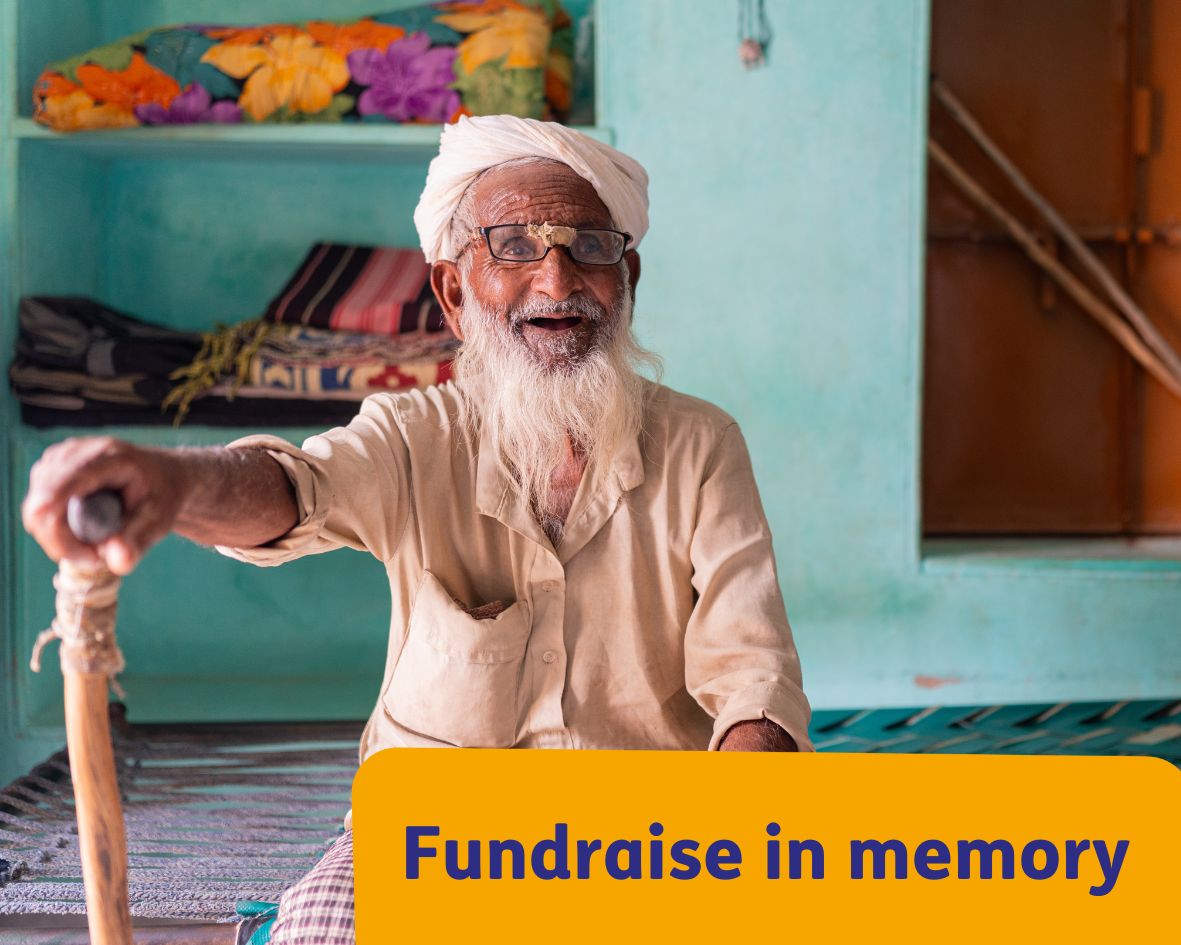 Older man smiling at camera in India