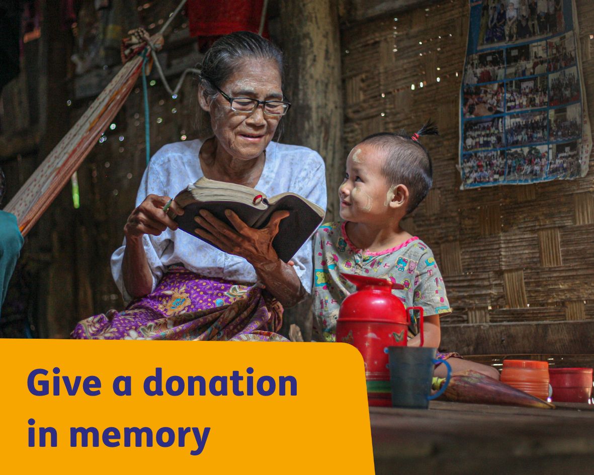 Older lady in Myanmar with grandchild